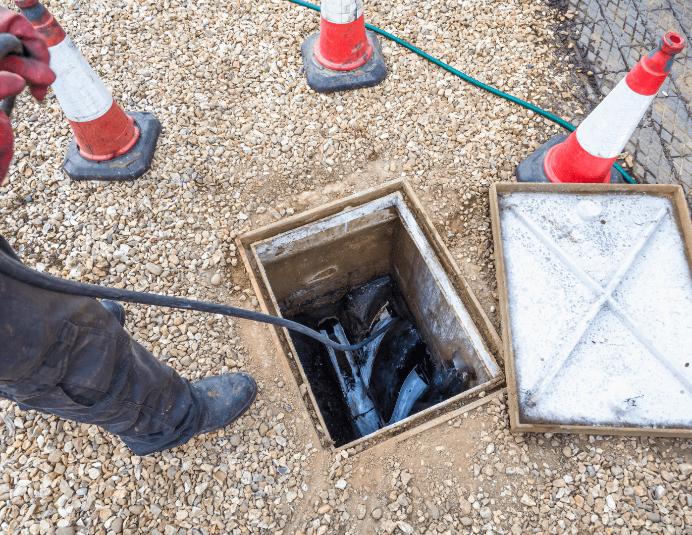 Underground drain repair work at an excavated pipe section
